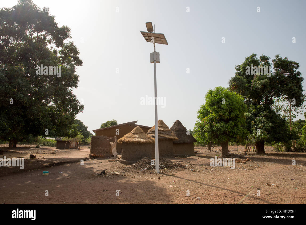 Baro village, Guinea, 1st May 2015: Solar powered street lighting, very recently installed. Stock Photo