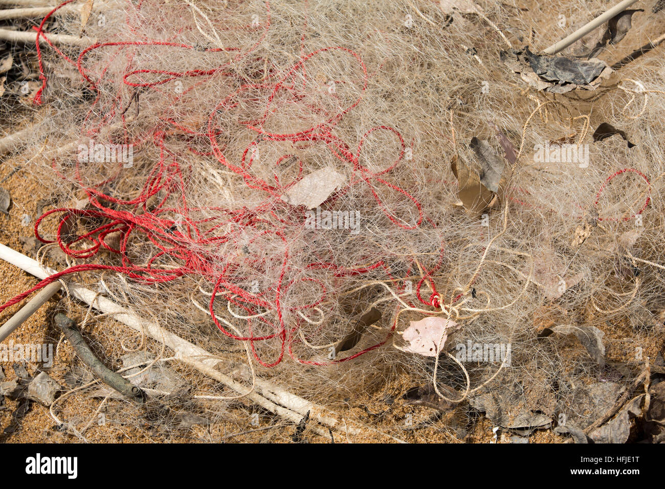 Baro village, Guinea, 1st May 2015: Discarded fine fishing nets. These llegal nets catch the young immature fish before they can become adults. Stock Photo