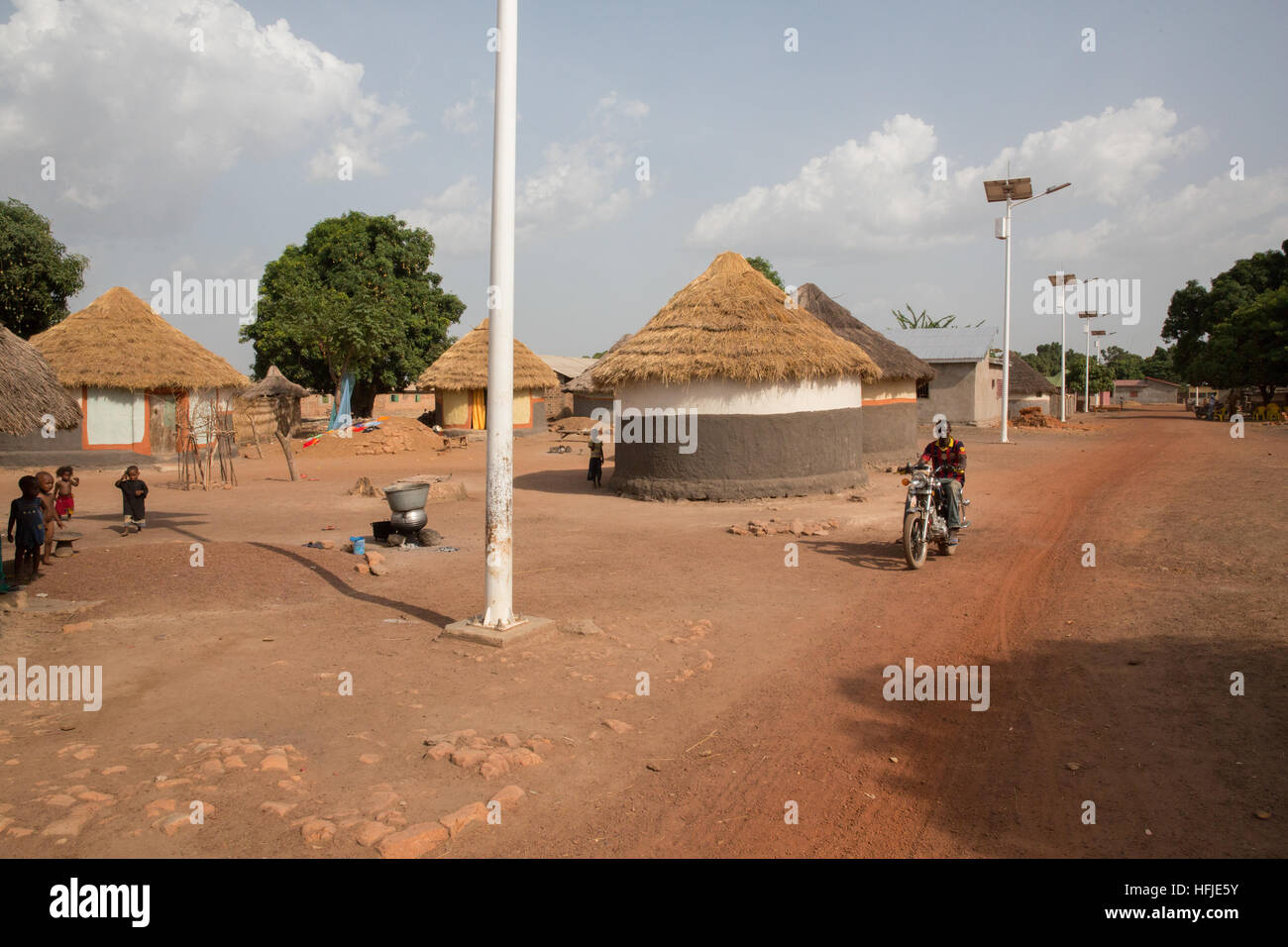 Baro village, Guinea, 1st May 2015: Solar powered street lighting, very recently installed. Stock Photo