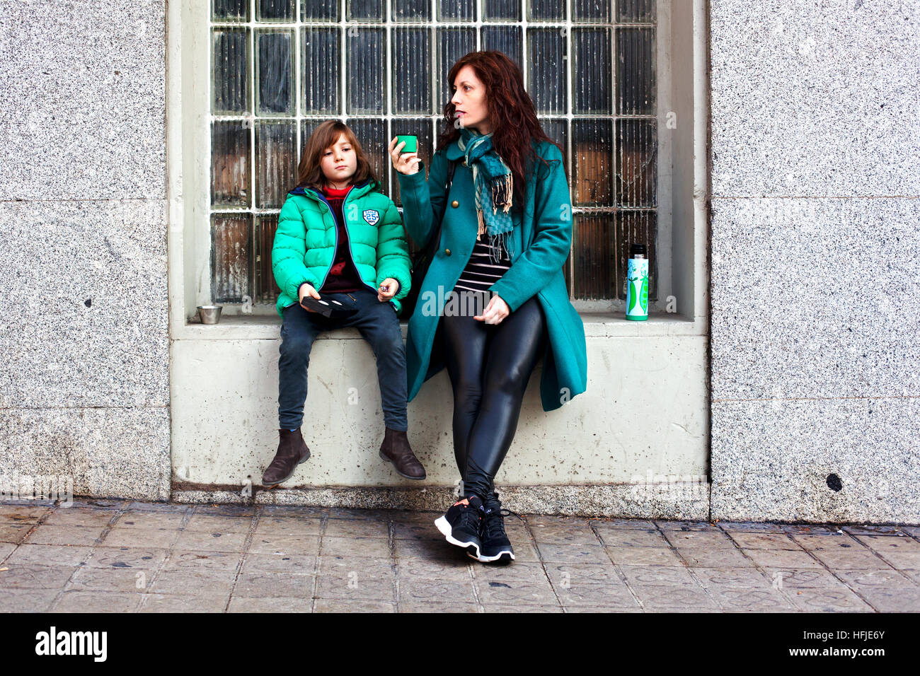 Spanish mother and son having tea in the street, Barcelona Stock Photo