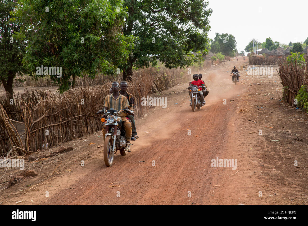 Gbderedou Baranama, Guinea, 2nd May 2015; Young people leaving in the early morning for the Sanana mines, 12 kms away. Stock Photo