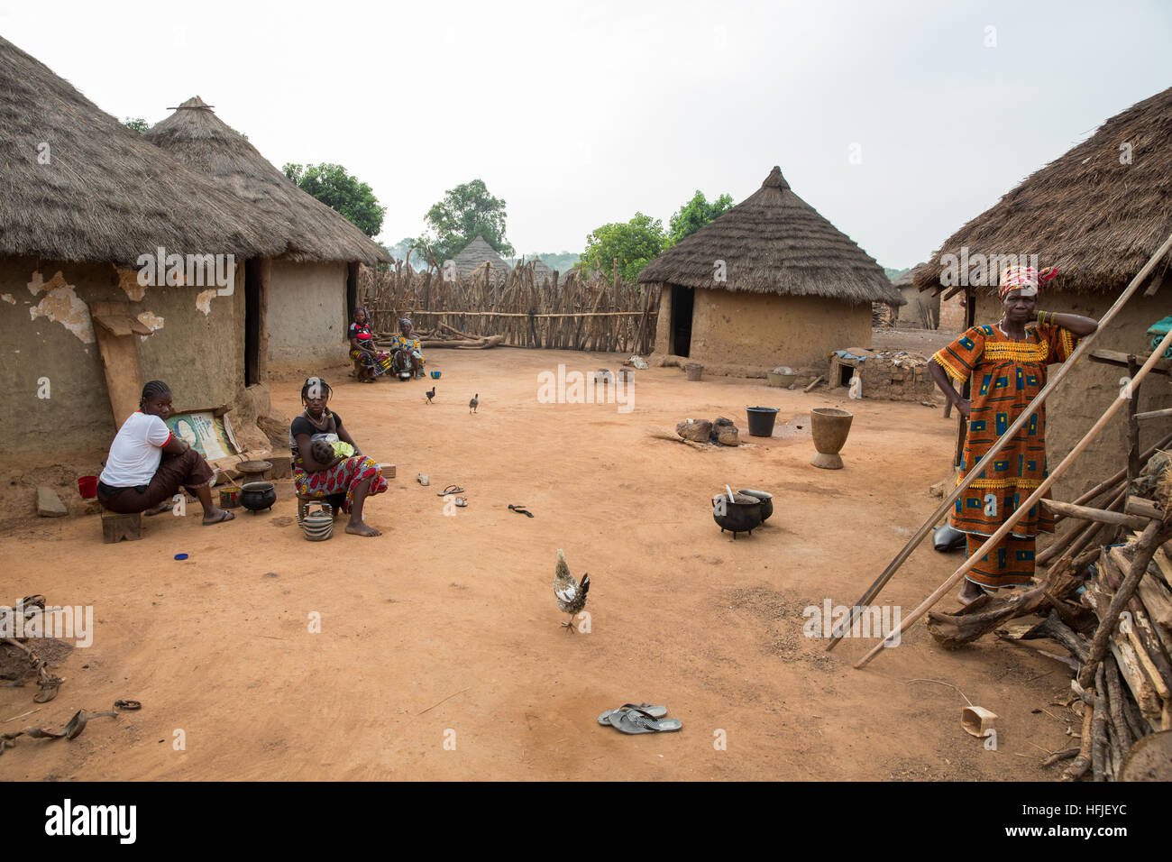Koumban village, Guinea, 2nd May 2015; Daily life in the early morning in a compound with several wives. Stock Photo
