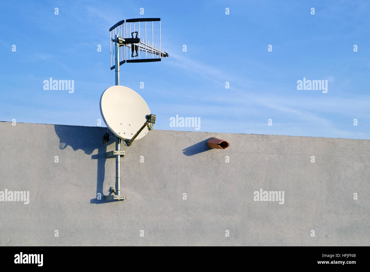 satelite is attached to the wall of the house . Stock Photo