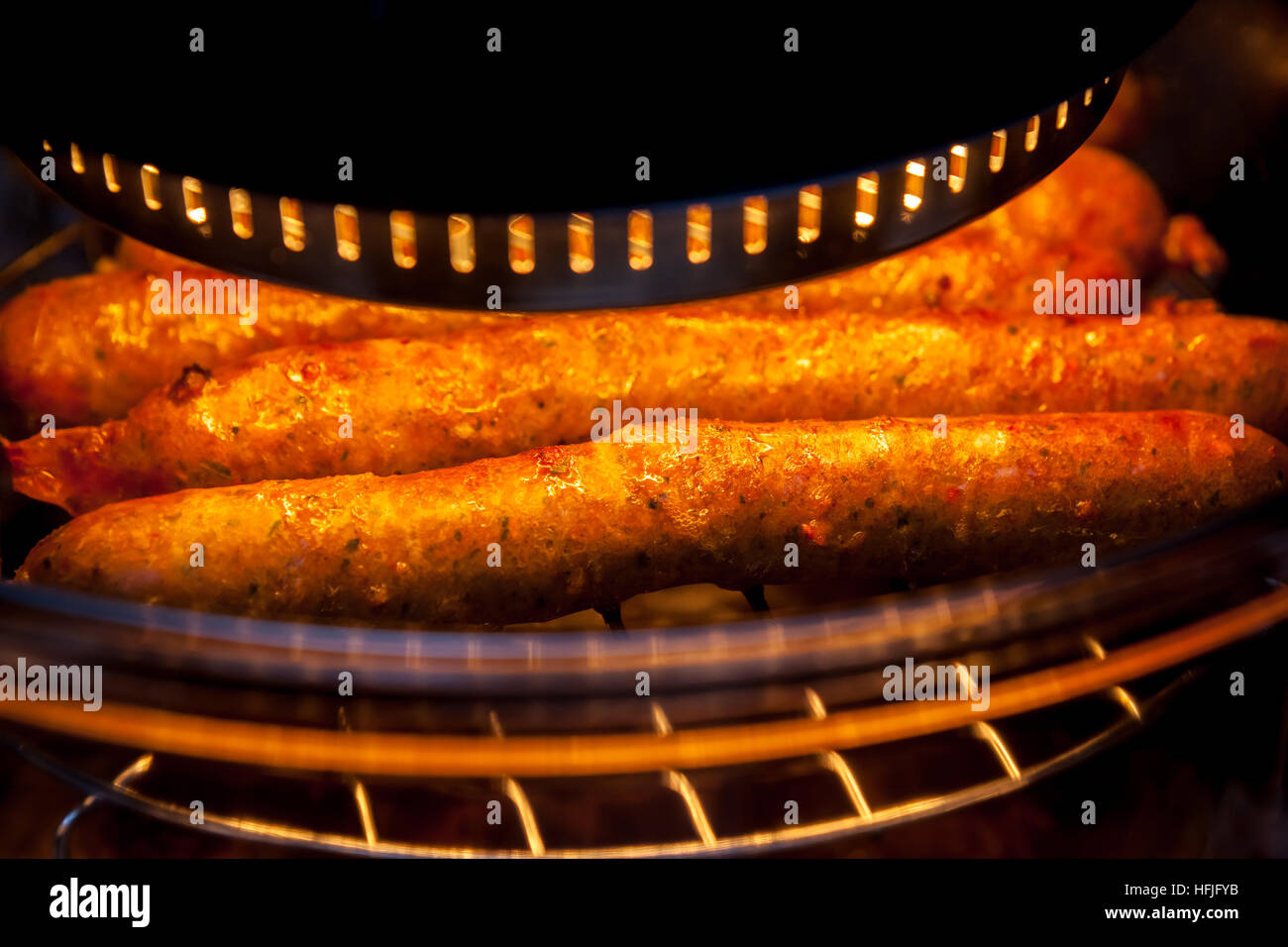 homemade farmer sausages in the oven heating Stock Photo Alamy