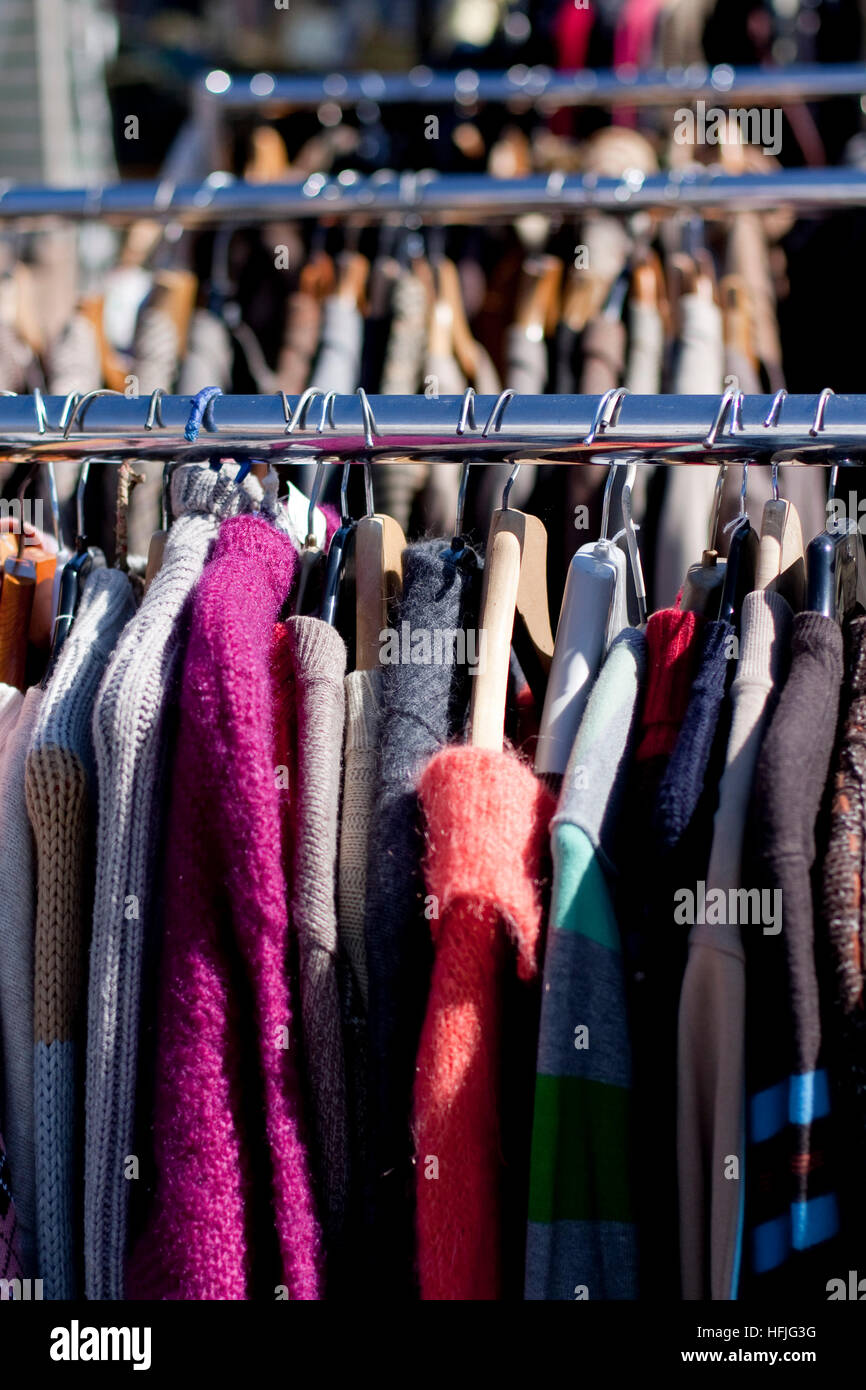 Racked jumpers on a Suffolk street market Stock Photo