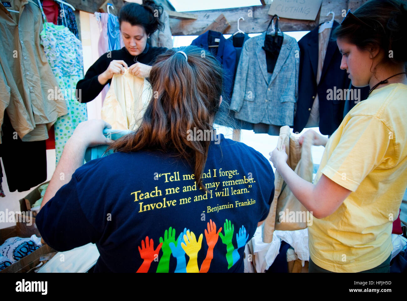 Young Hurricane Katrina relief workers  gather food clothing and supplies for affected local residents at a damaged church. Stock Photo