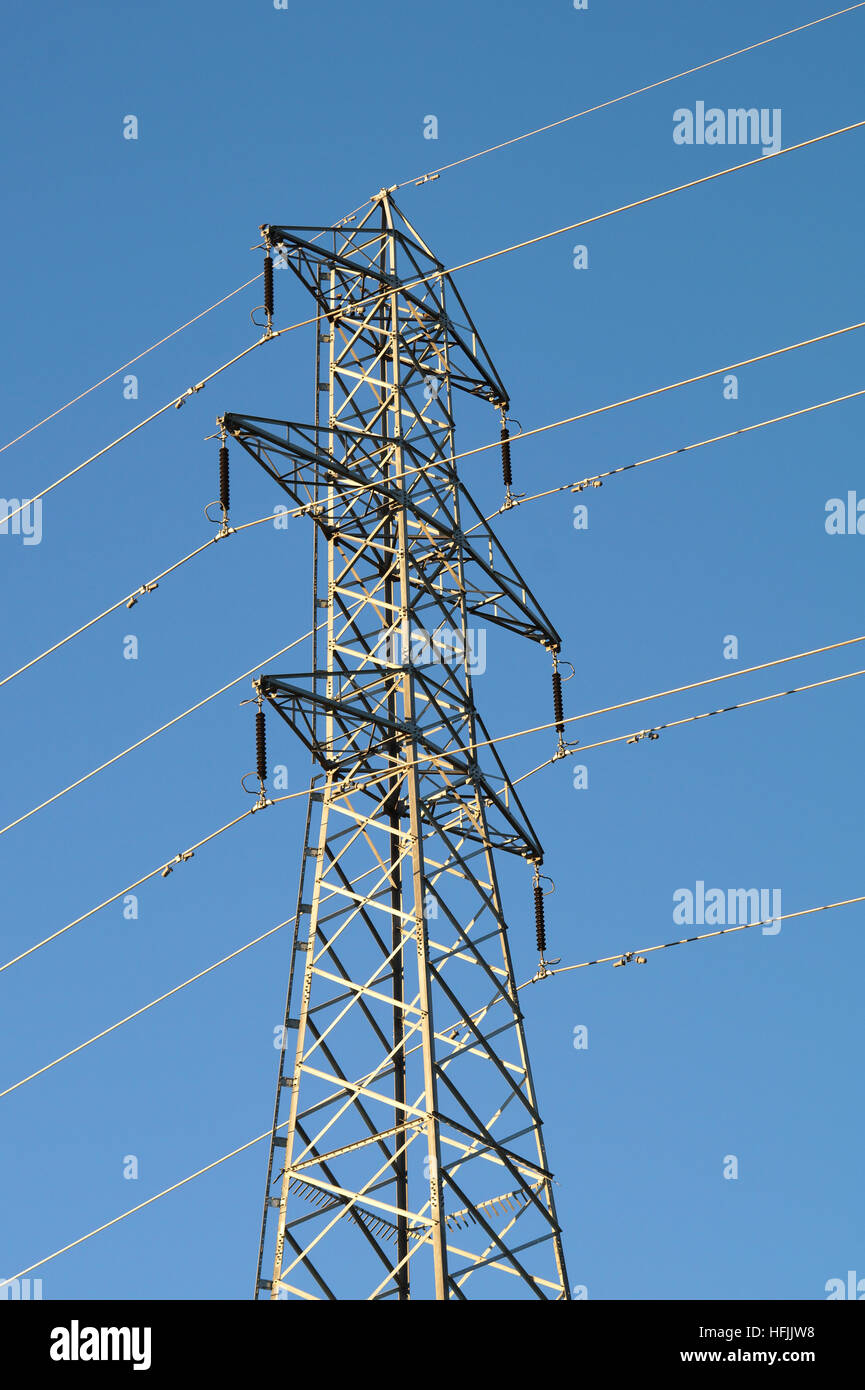 Power line against the blue sky Stock Photo - Alamy