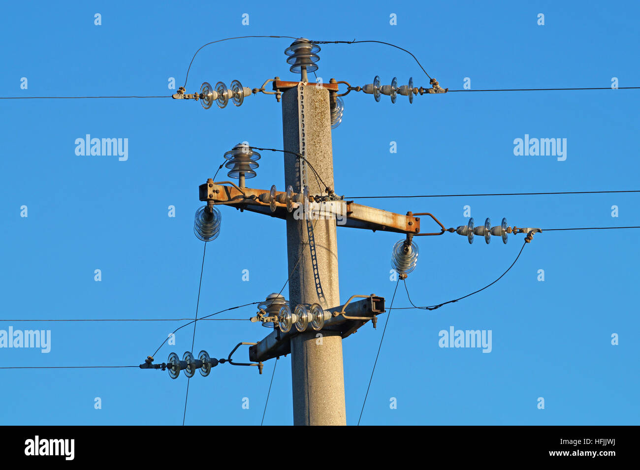 Power line against the blue sky Stock Photo