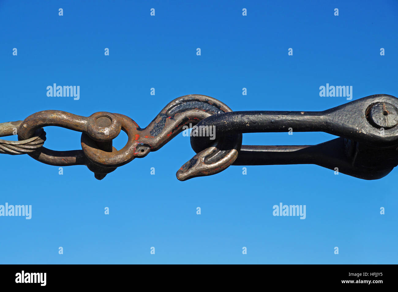 Closeup of metal fasteners and steel wire rope . clamp Stock Photo Alamy