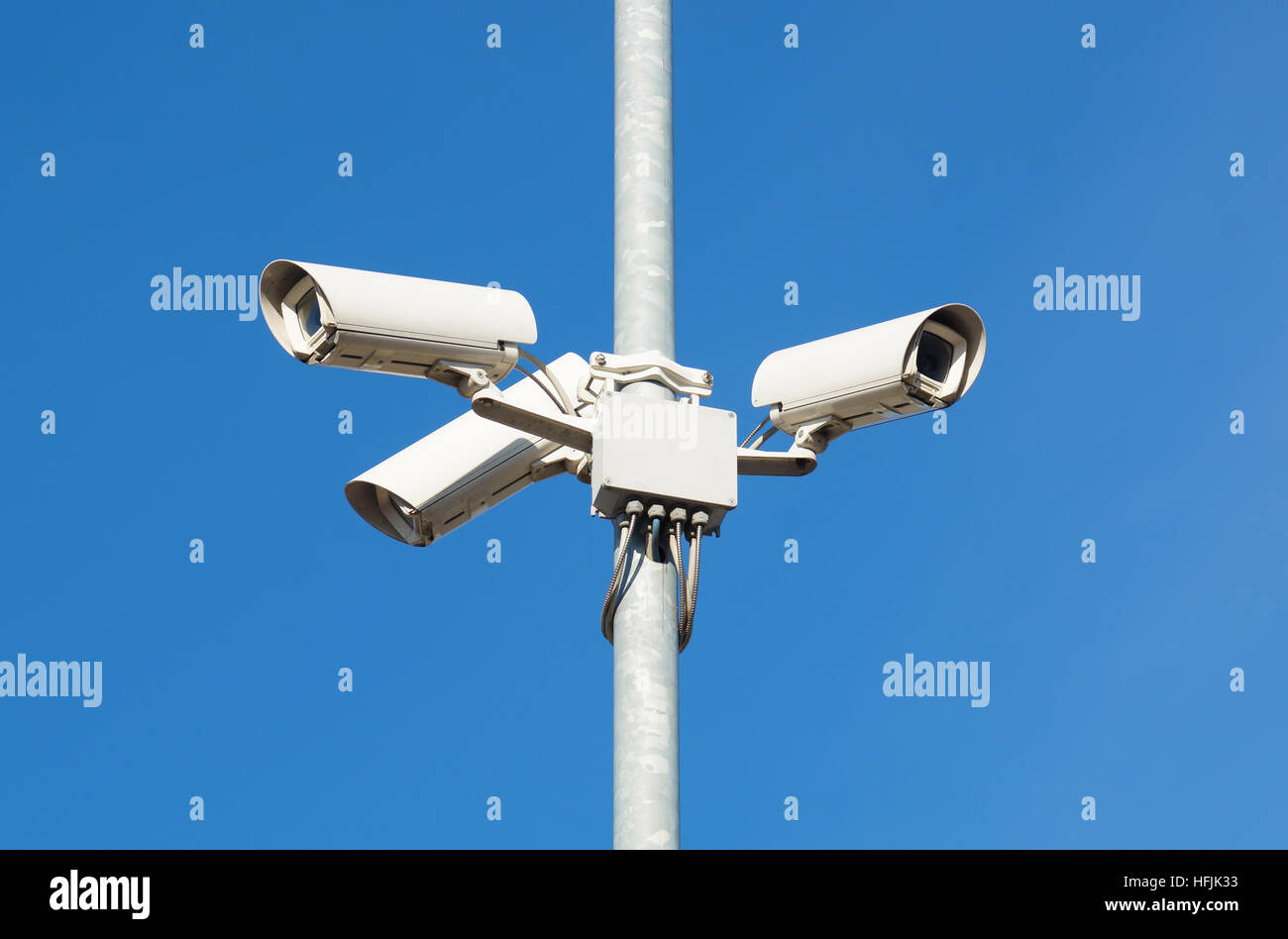 Surveillance cameras against blue sky Security Cctv Stock Photo Alamy