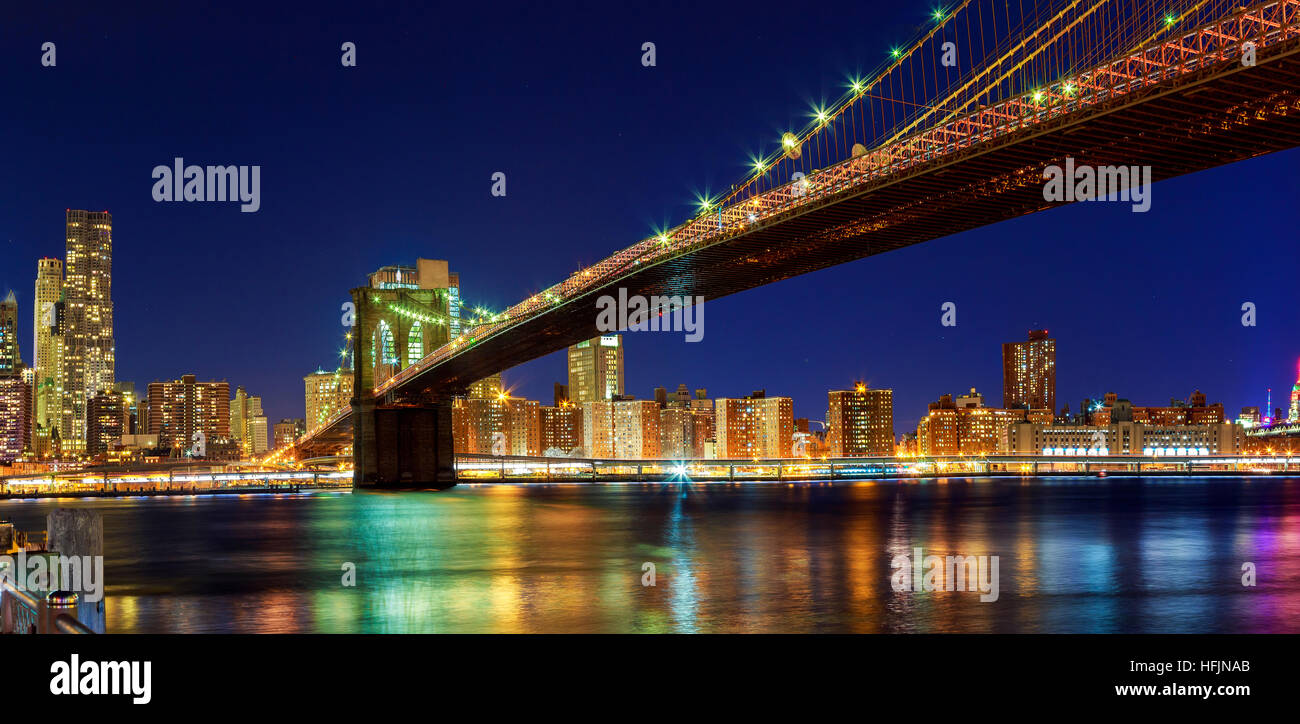 Brooklyn Bridge over East River at night in New York City Manhattan ...
