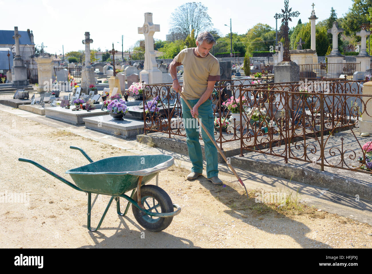 groundskeeper in cemetery Stock Photo Alamy