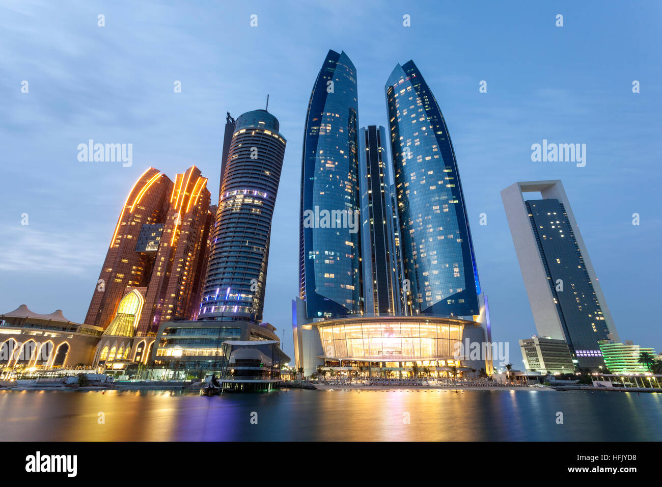 The Etihad Towers in Abu Dhabi illuminated at night. Stock Photo