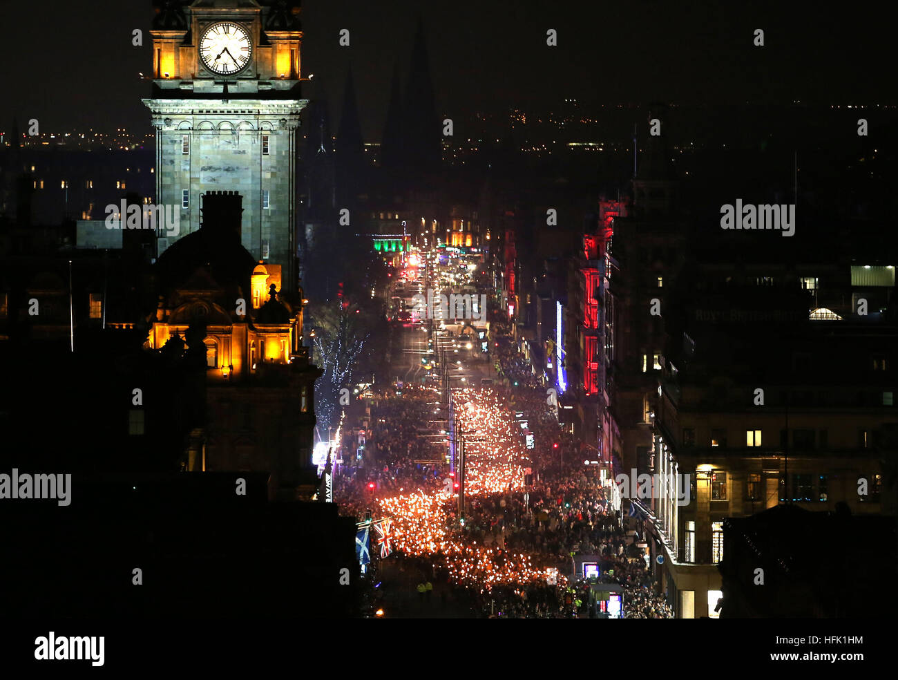 The opening event of Edinburgh's Hogmanay celebrations begins with the annual Torchlight Procession, as thousands of torch carriers led by Shetland's Up Helly Aa' Vikings and the massed pipes and drums march through the city centre to a spectacular fireworks finale ahead of the Hogmanay celebrations for the New Year. Stock Photo