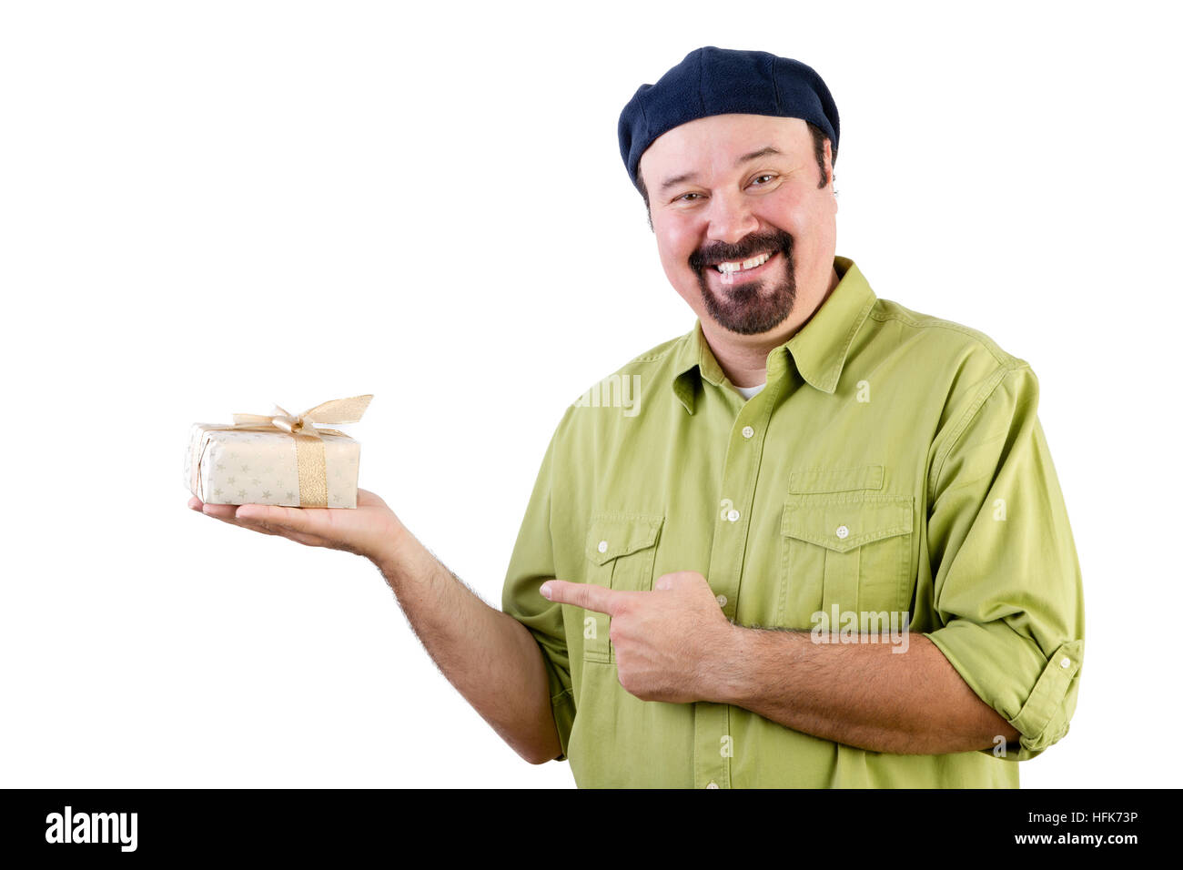 Smiling middle aged man in French beret holding wrapped gift on white Stock Photo
