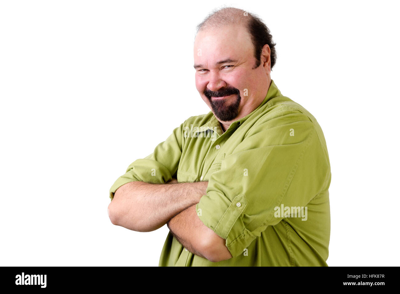 Half body portrait of smirking middle aged man with folded arms on white Stock Photo