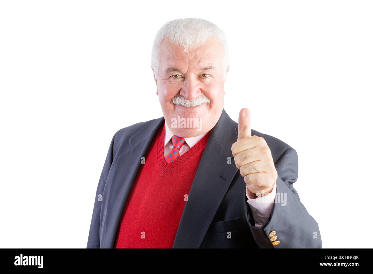 Cheeky senior gives a thumbs up and smiles at the camera while wearing a business suit Stock Photo