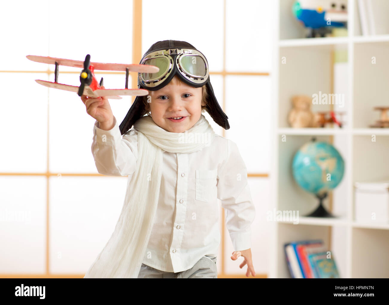 happy child boy play in airplane indoors Stock Photo
