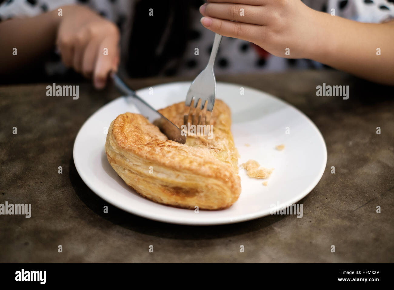 Eating apple puff turnover pastry in dish Stock Photo Alamy