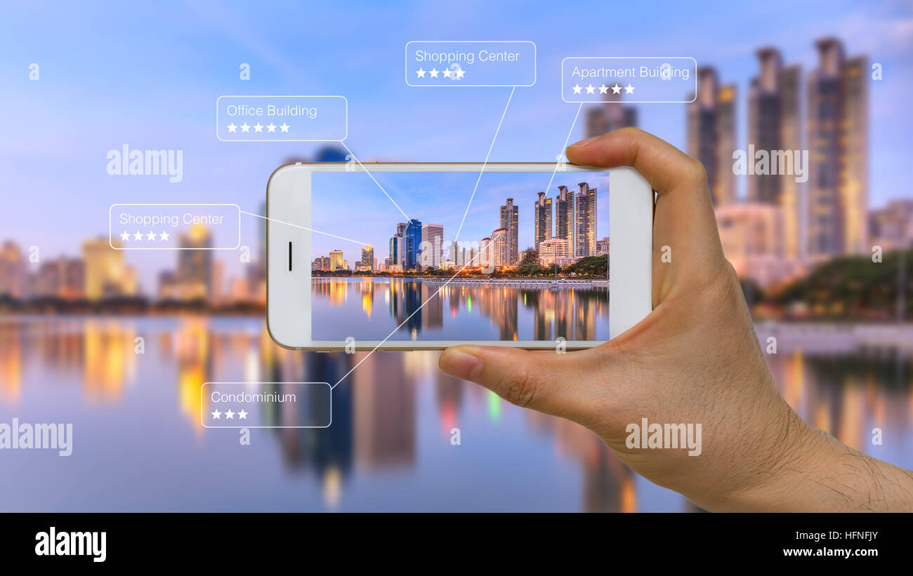 Smart device showing augmented reality or AR app on screen. Stock Photo