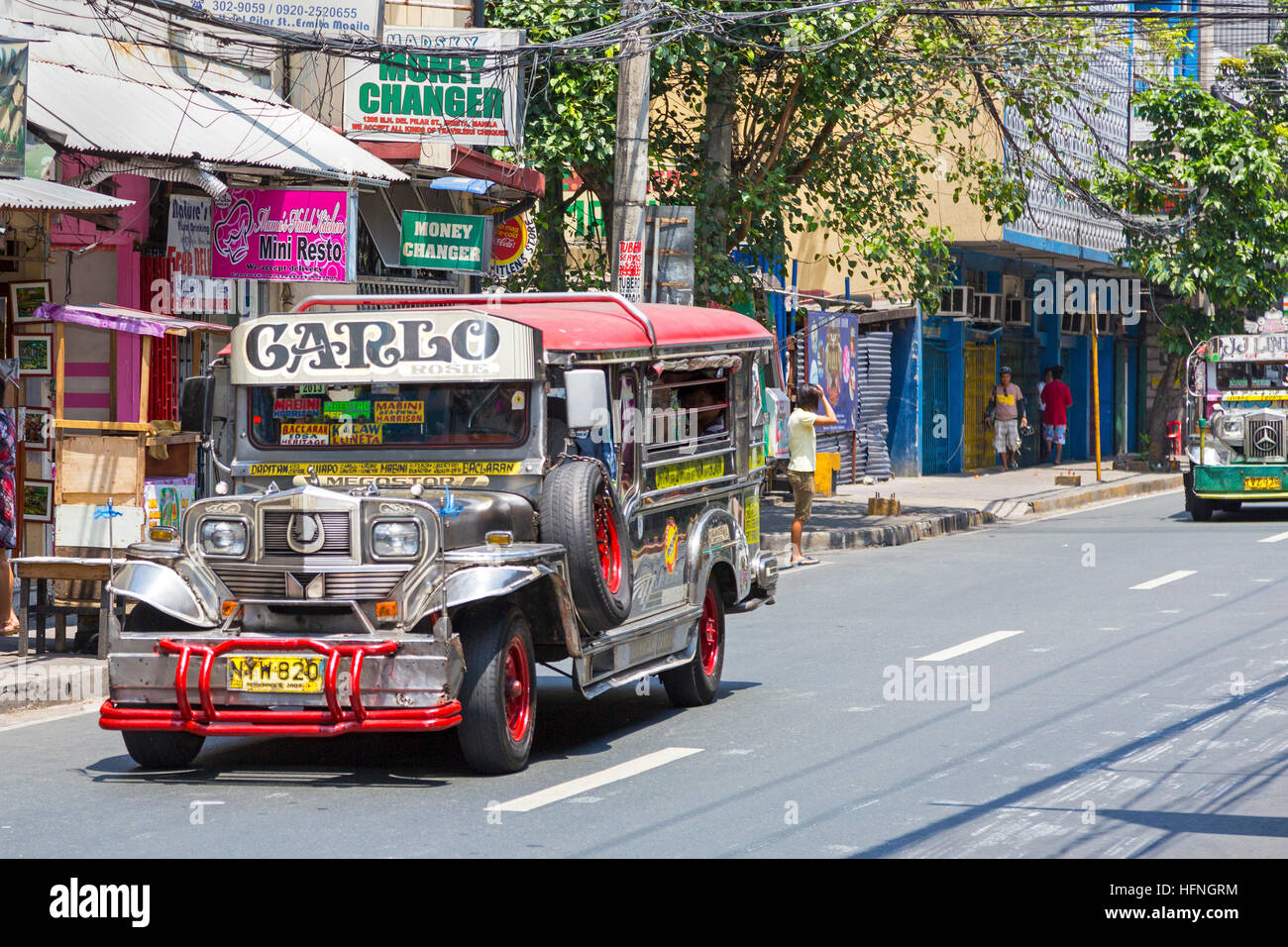 Jeepney service on the street in city centre, Manila, Philippines Stock Photo