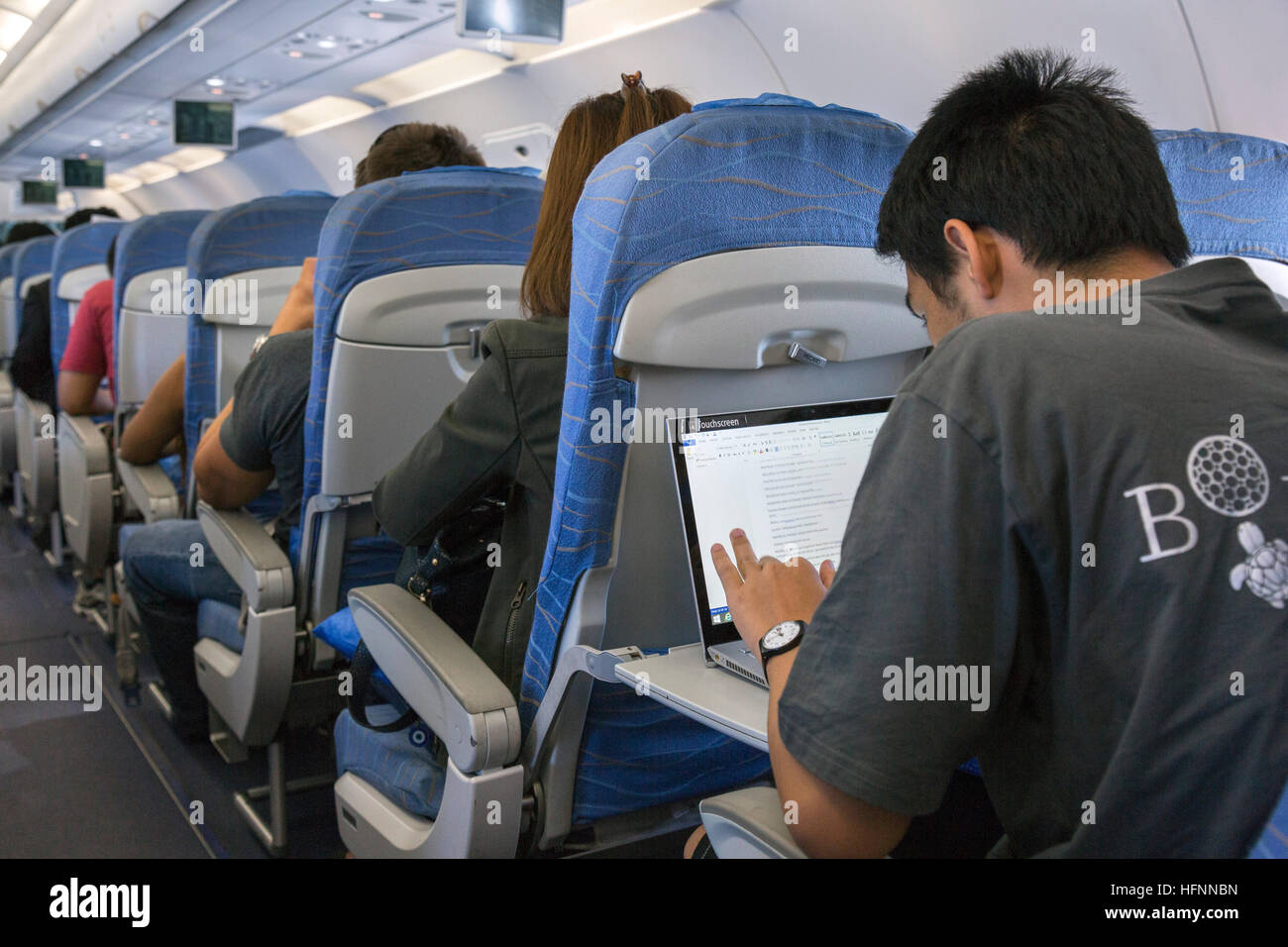 Passengers on Philippine Airlines flight from Manila Stock Photo Alamy