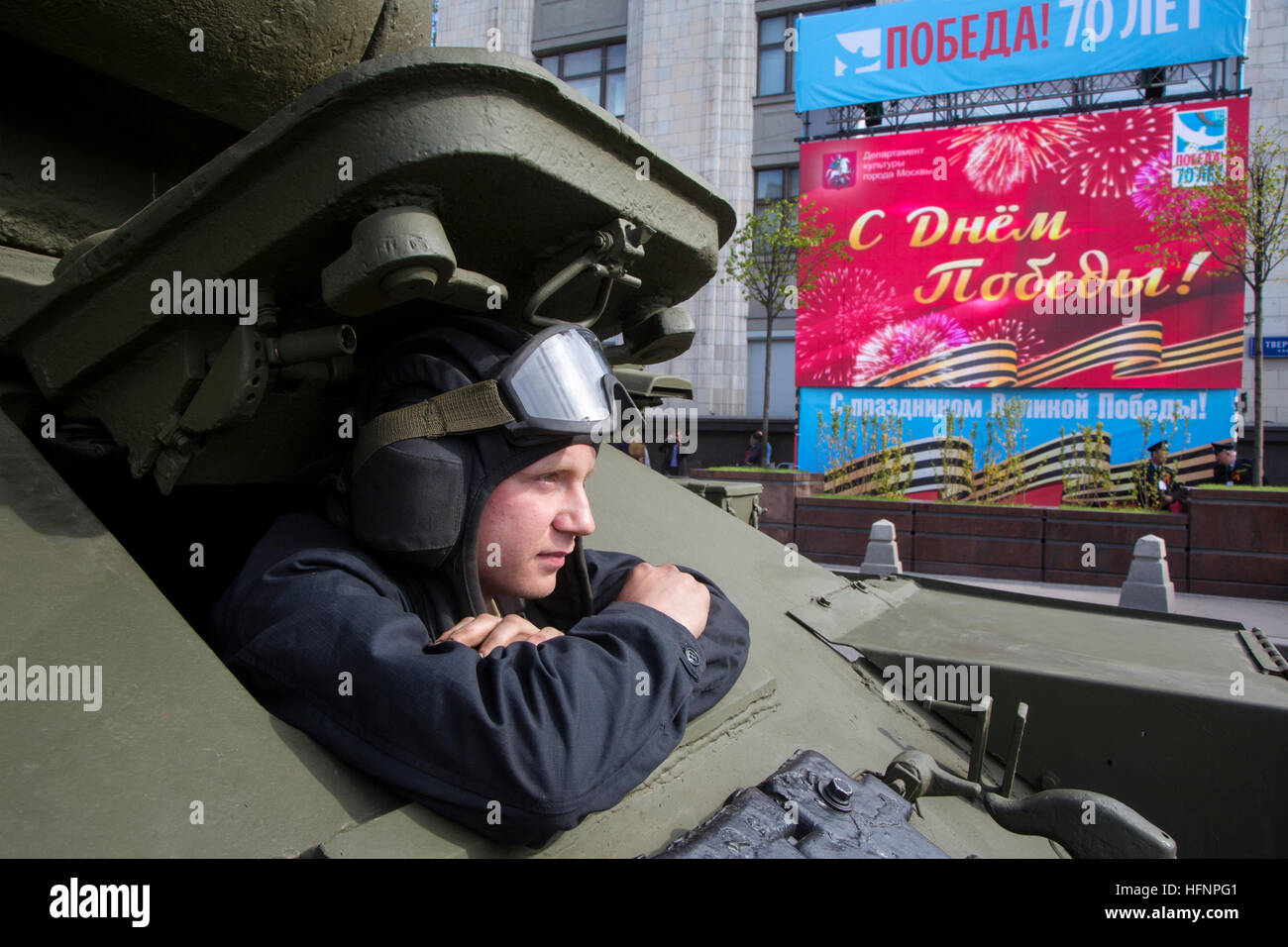 Closeup portrait of tankman in the vintage soviet tank T-34 during the Great Victory parade in Moscow Stock Photo