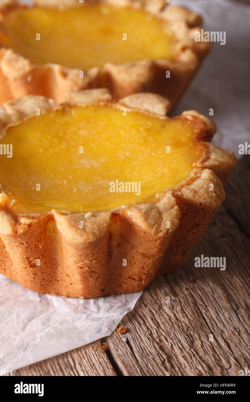 Traditional Egg Tart close up on paper. vertical Stock Photo