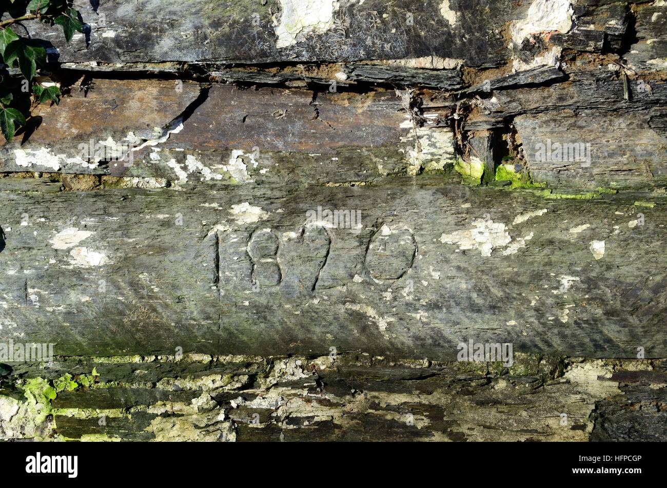 date of building carved on to a stone wall of a derelict Welsh cottage  ruin ruins Nevern Pembrokeshire Wales Stock Photo