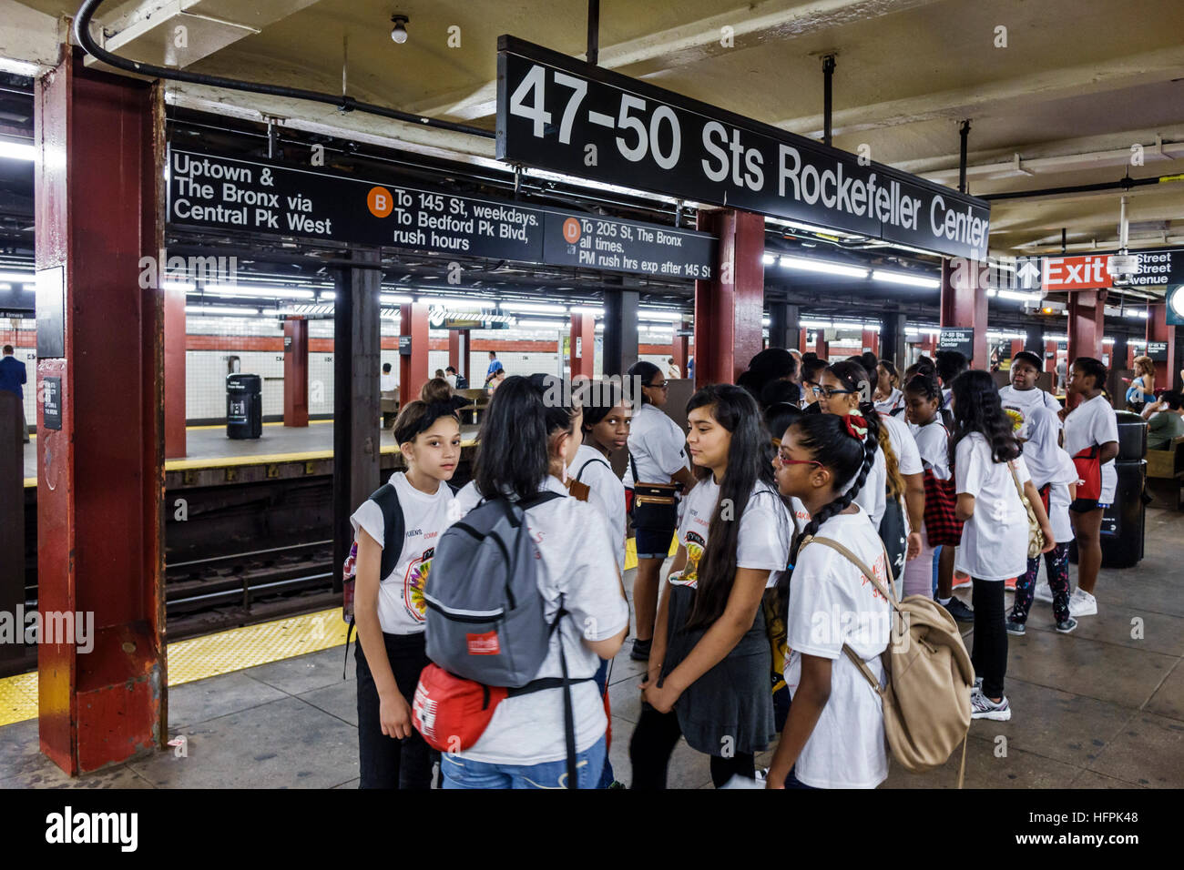 New York City,NY NYC,subway,MTA,public transportation,Rockefeller Center,station,platform,Asian Asians ethnic immigrant immigrants minority,Black Blac Stock Photo