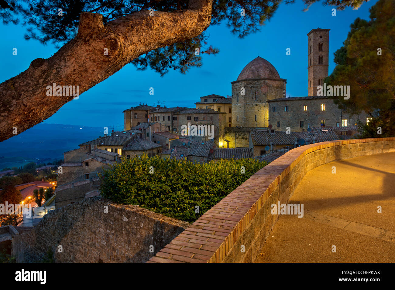 Twilight over the Cathedral of Santa Maria Assunta and the medieval town of Volterra, Tuscany, Italy Stock Photo