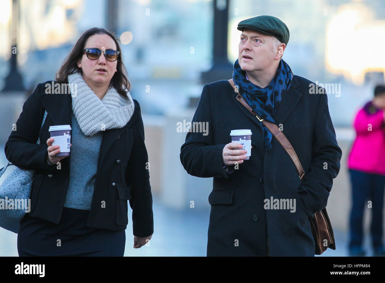 People brave the freezing weather while out and about on a cold but sunny day in London. It was a cold and frosty start to the day across the south of the UK.  Featuring: Atmosphere Where: London, United Kingdom When: 30 Nov 2016 Stock Photo