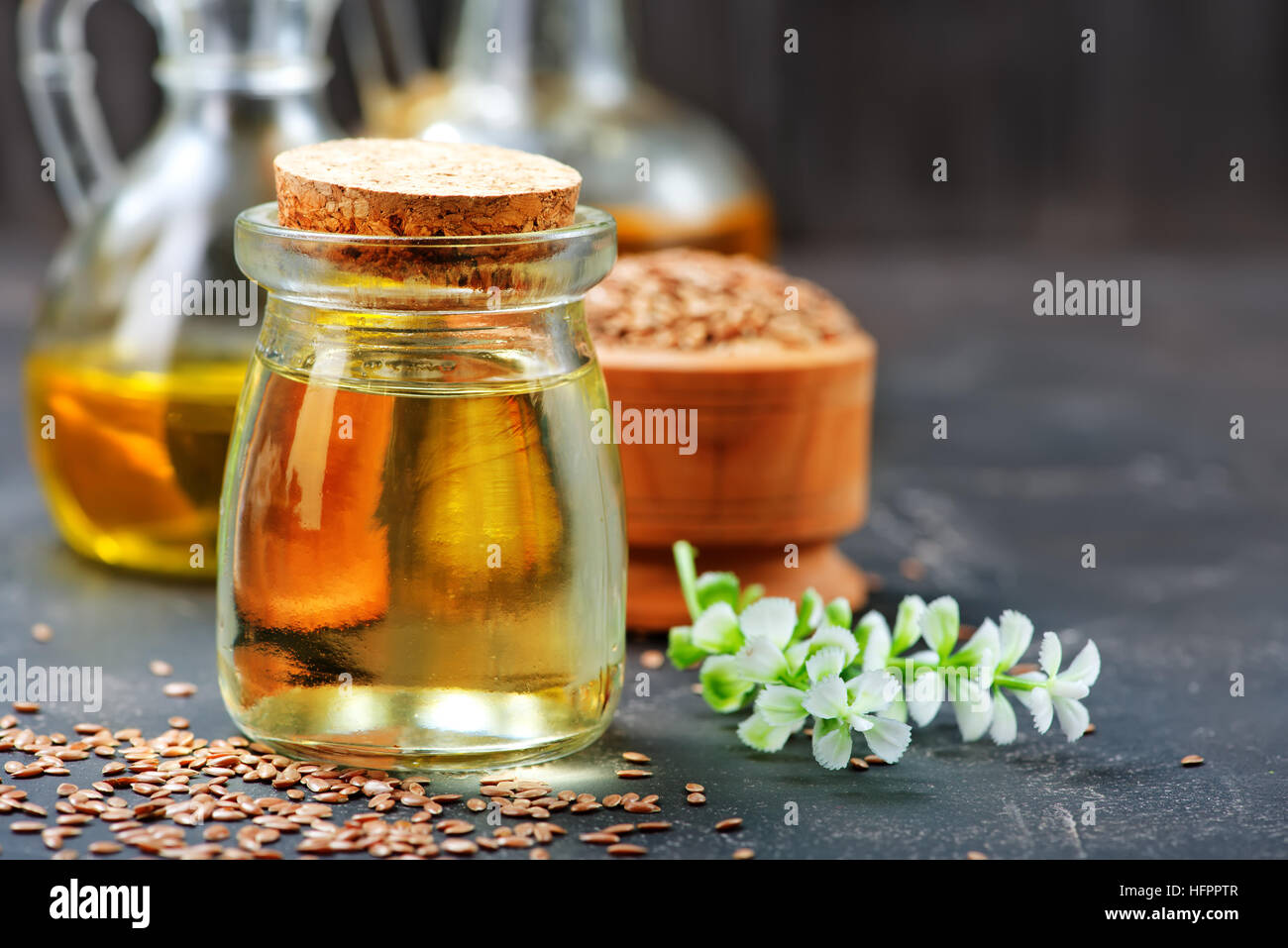 flax seed and oil on a table Stock Photo Alamy