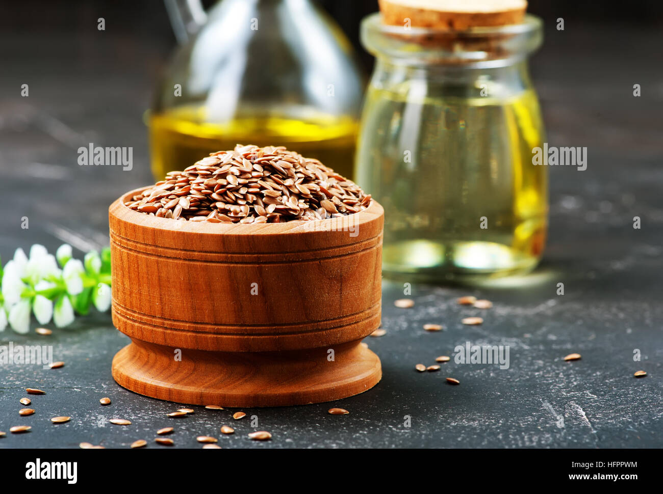 flax seed and oil on a table Stock Photo Alamy