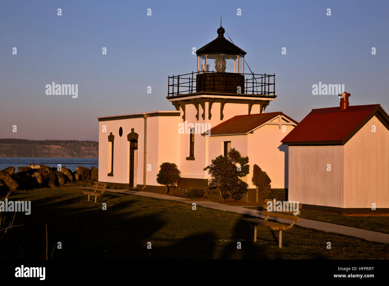 WA13042-00...WASHINGTON - Sunset at Point No Point Lighthouse on the Puget Sound. Stock Photo