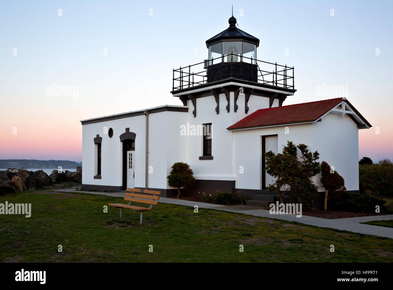 WA13047-00...WASHINGTON - Dusk at Point No Point Lighthouse located on the Puget Sound near Hansville. Stock Photo