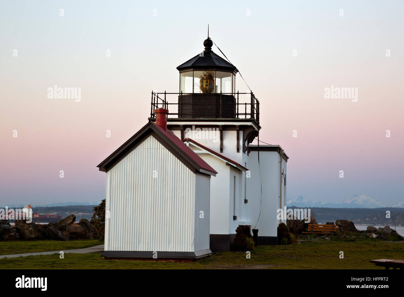 WASHINGTON - Dusk at Point No Point Lighthouse located on the Puget Sound near Hansville with the Cascade Mountains to the east. Stock Photo