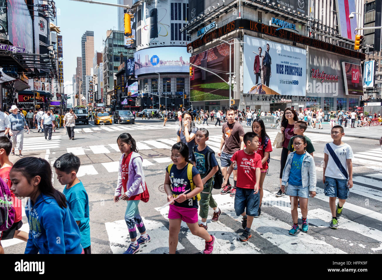 New York City,NY NYC,Manhattan,Midtown,Times Square,street crossing,intersection,Asian Asians ethnic immigrant immigrants minority,boy girl,student st Stock Photo