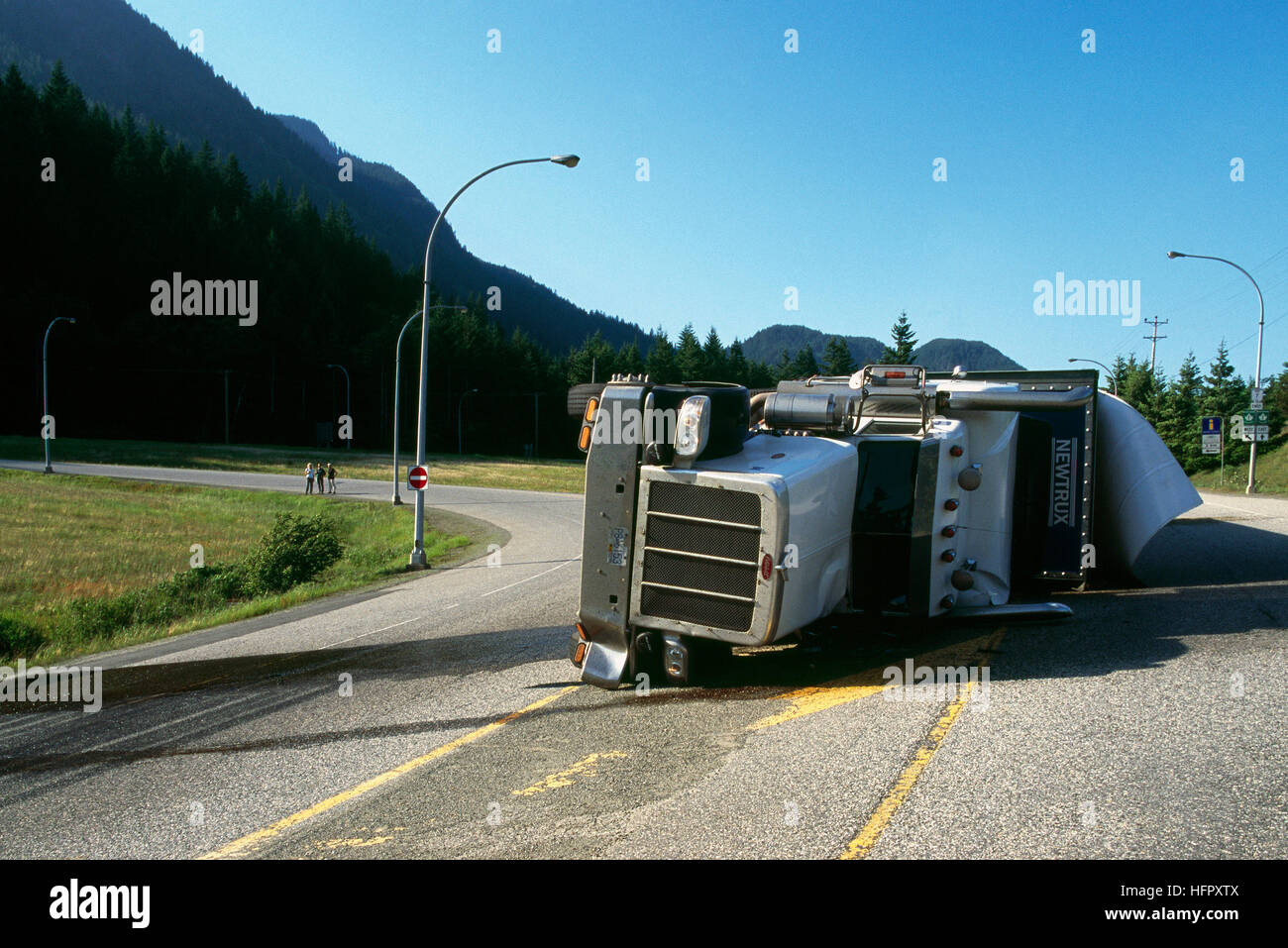 Highway Accident, Overturned Semi Trailer Truck, BC, British Columbia, Canada - Road Accidents Stock Photo