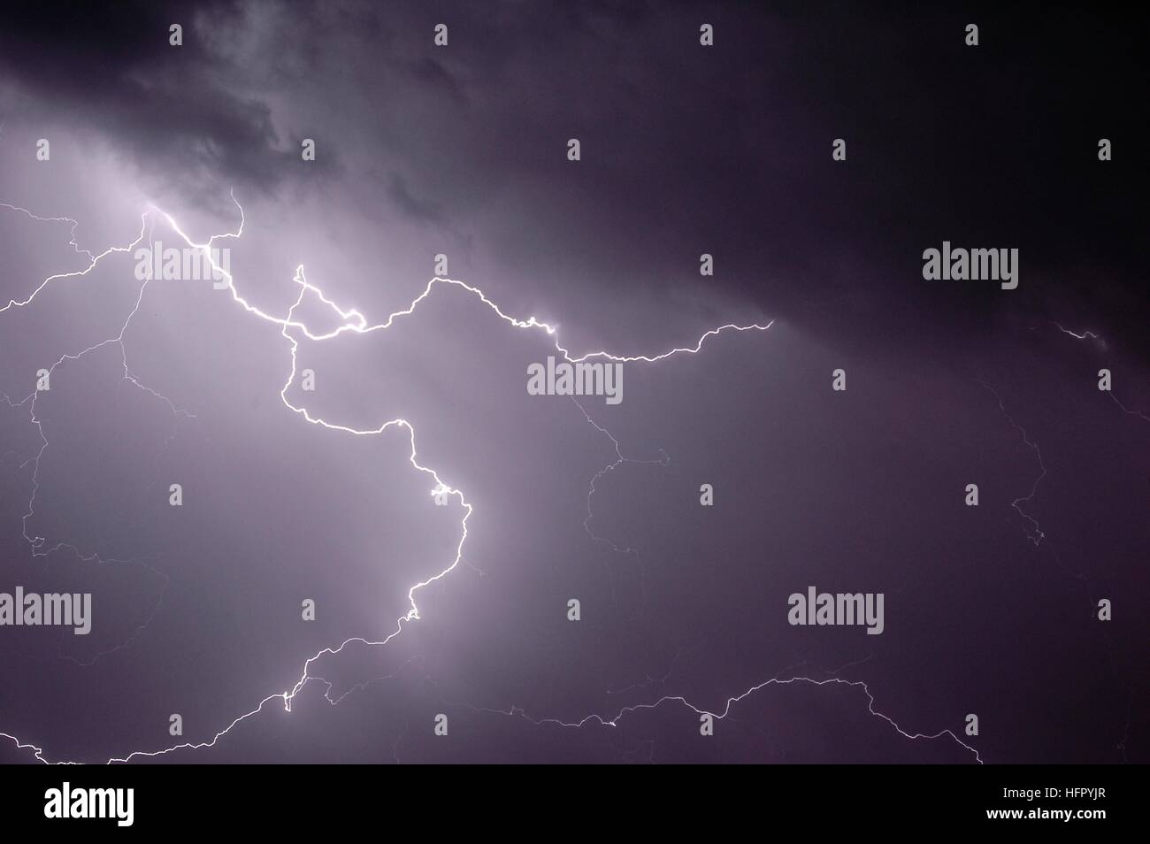 A flash of lightning during a nighttime storm Stock Photo Alamy