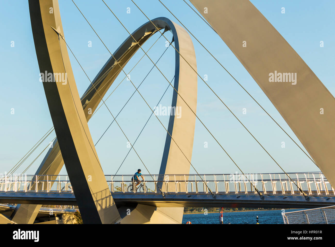 Cyclist crossing the Elizabeth Quay bridge on the Swan River, Perth, Western Australia, Australia Stock Photo