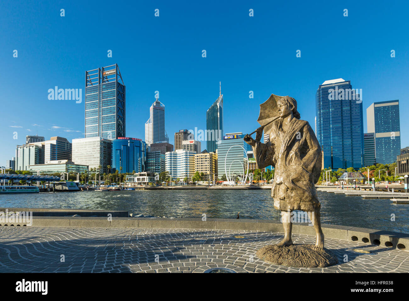 The Bessie Rischbieth Statue by artist Jon Tarry at Elizabeth Quay, with the city skyline beyond, Perth, Western Australia, Australia Stock Photo