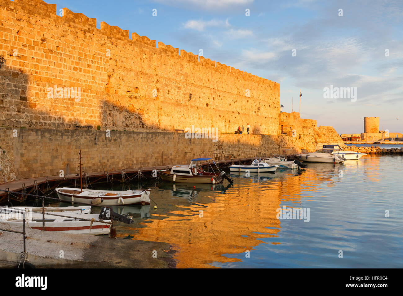 Old harbor and city walls of the medieval town of Rhodes in Greece ...