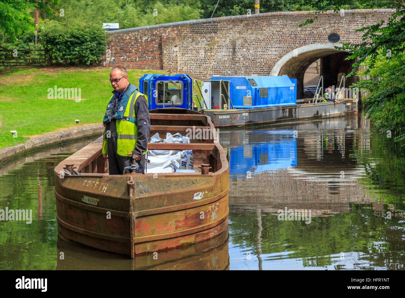 Canal & River Trust volunteers travelling by canal boat to work on the Staffordshire & Worcestershire Canal, Stock Photo