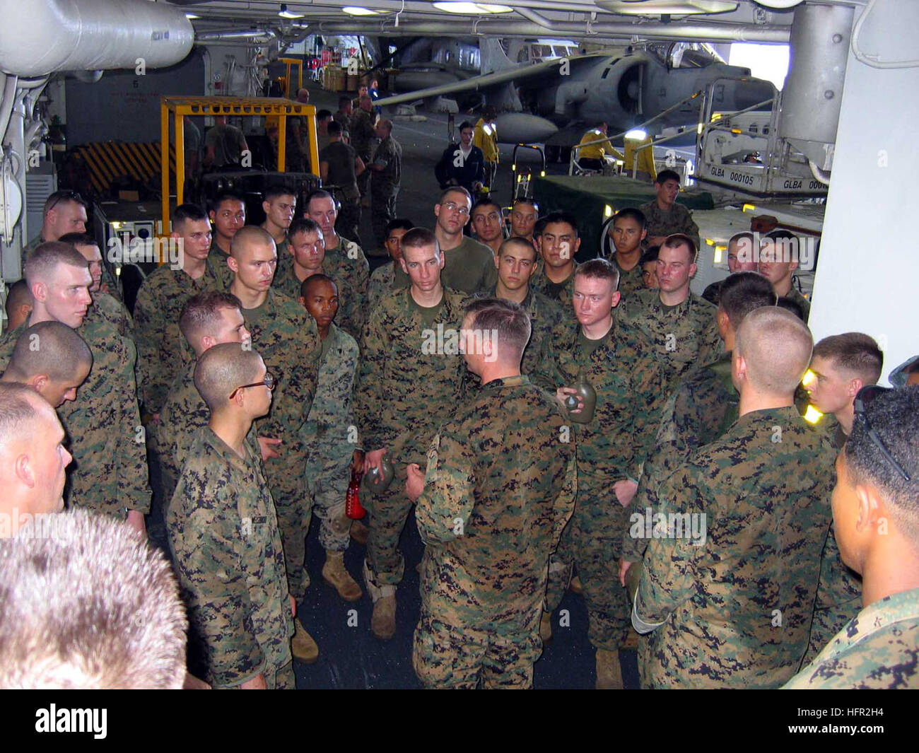 060219-N-4880C-003 Off the coast of Southern Leyte, Republic of the Philippines (Feb. 19, 2006) Ð Marines from the 31st Marine Expeditionary Unit (31MEU) are briefed in the shipÕs hangar bay aboard the amphibious assault ship USS Essex (LHD 2), before going ashore to assist with rescue efforts following the Feb. 17 landslide. Essex along with the dock landing ship USS Harpers Ferry (LSD 49) are on station off the Philippine coast rendering relief and assistance to the victims of the landslide.  Both are part of the Forward Deployed Amphibious Ready Group, the NavyÕs only forward deployed amphi Stock Photo
