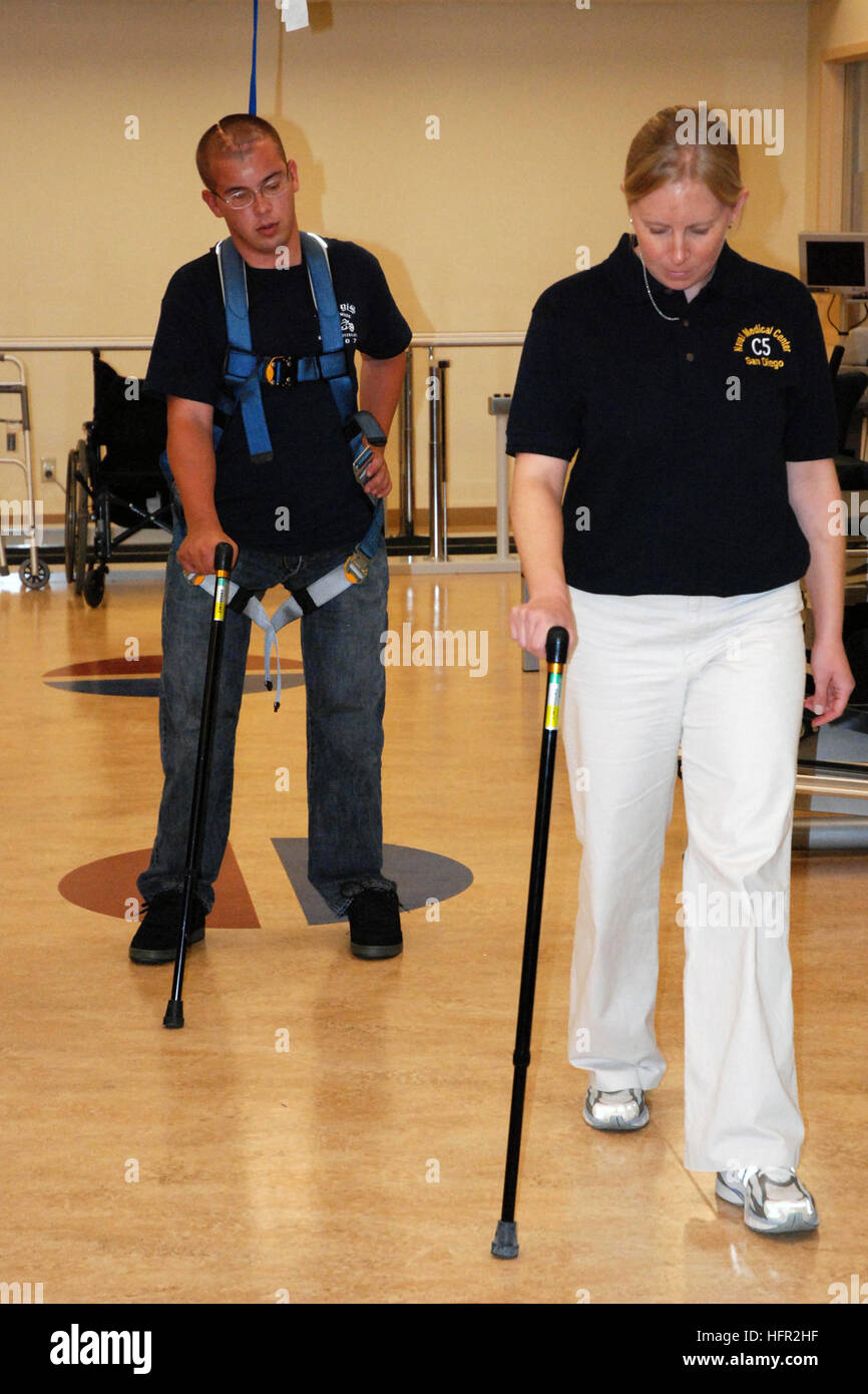 071015-N-5086M-202  SAN DIEGO (Oct. 15, 2007) - Retired Marine Corps Cpl. Timothy Jeffers walks on his prosthetic legs while using the hands-free harness walking gait training device during a therapy session in the new Comprehensive Combat and Complex Casualty Care (C5) facility. C5 is a program of care that manages severely injured or ill patients from medical evacuation through in patient care, out patient rehabilitation, and eventual return to active duty or transition from the military. U.S. Navy photo by Mass Communication Specialist 2nd Class Greg Mitchell (RELEASED) US Navy 071015-N-508 Stock Photo