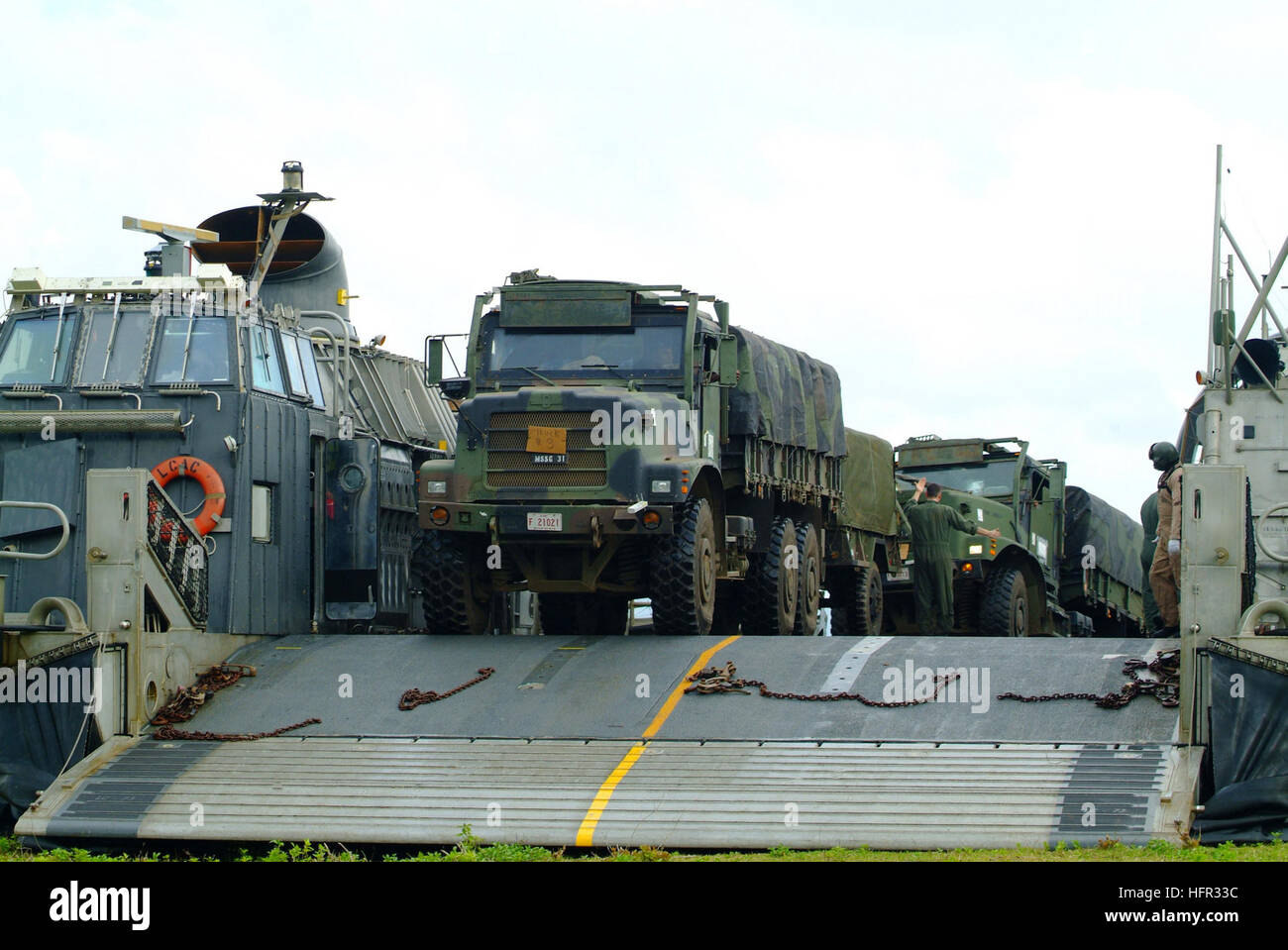 060303-N-4772B-028 Jolo, Philippines (March 3, 2006) Ð Marines assigned to the 31st Marine Service Support Group (MSSG) load equipment on a Landing Craft, Air Cushion (LCAC) on the island of Jolo, before heading out toward the amphibious dock landing ship USS Harpers Ferry (LSD 49). The joint efforts of more than 500 AFP and U.S. medical, dental, engineer and protection personnel were able to bring medical and dental support to more than 11,000 Filipino people and 504 animals, along with building four elementary schools. Harpers Ferry and Elements of the 31st Marine Expeditionary Unit (MEU) ar Stock Photo
