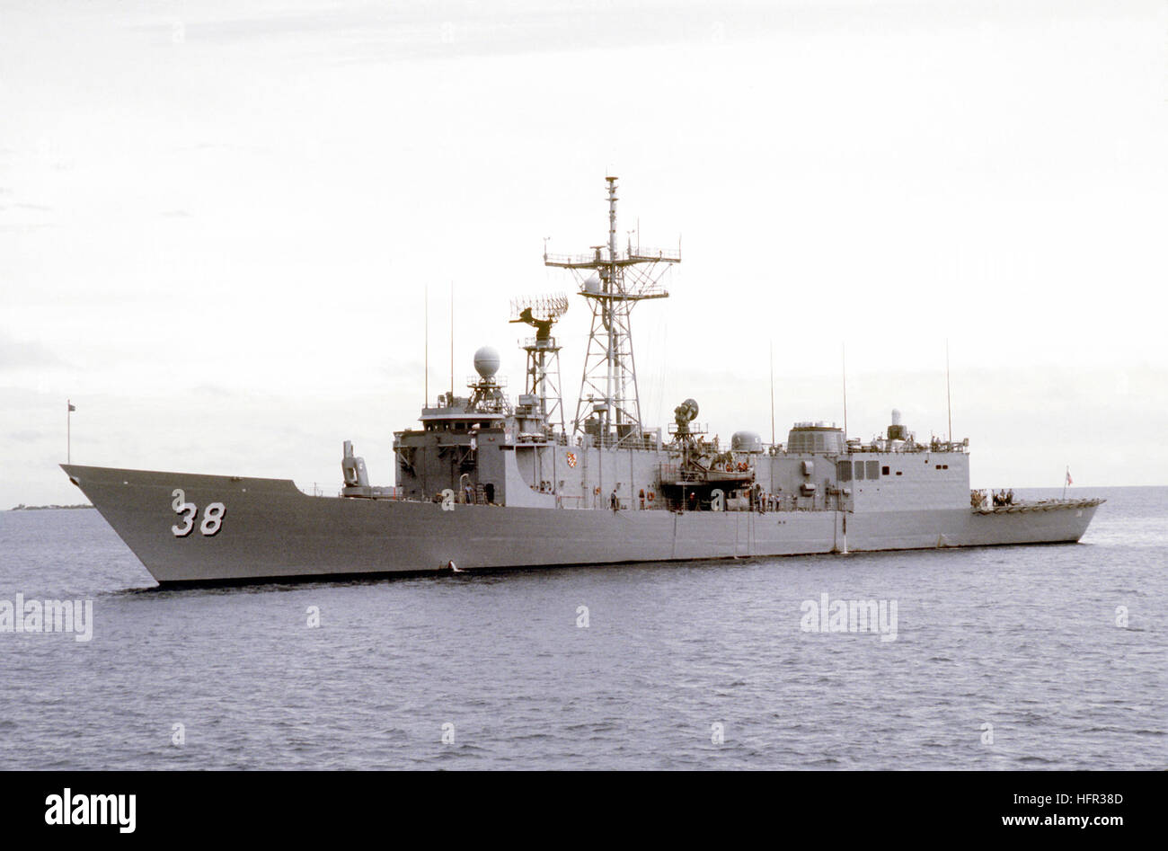 A port view of the guided missile frigate USS CURTS (FFG-38) departing ...