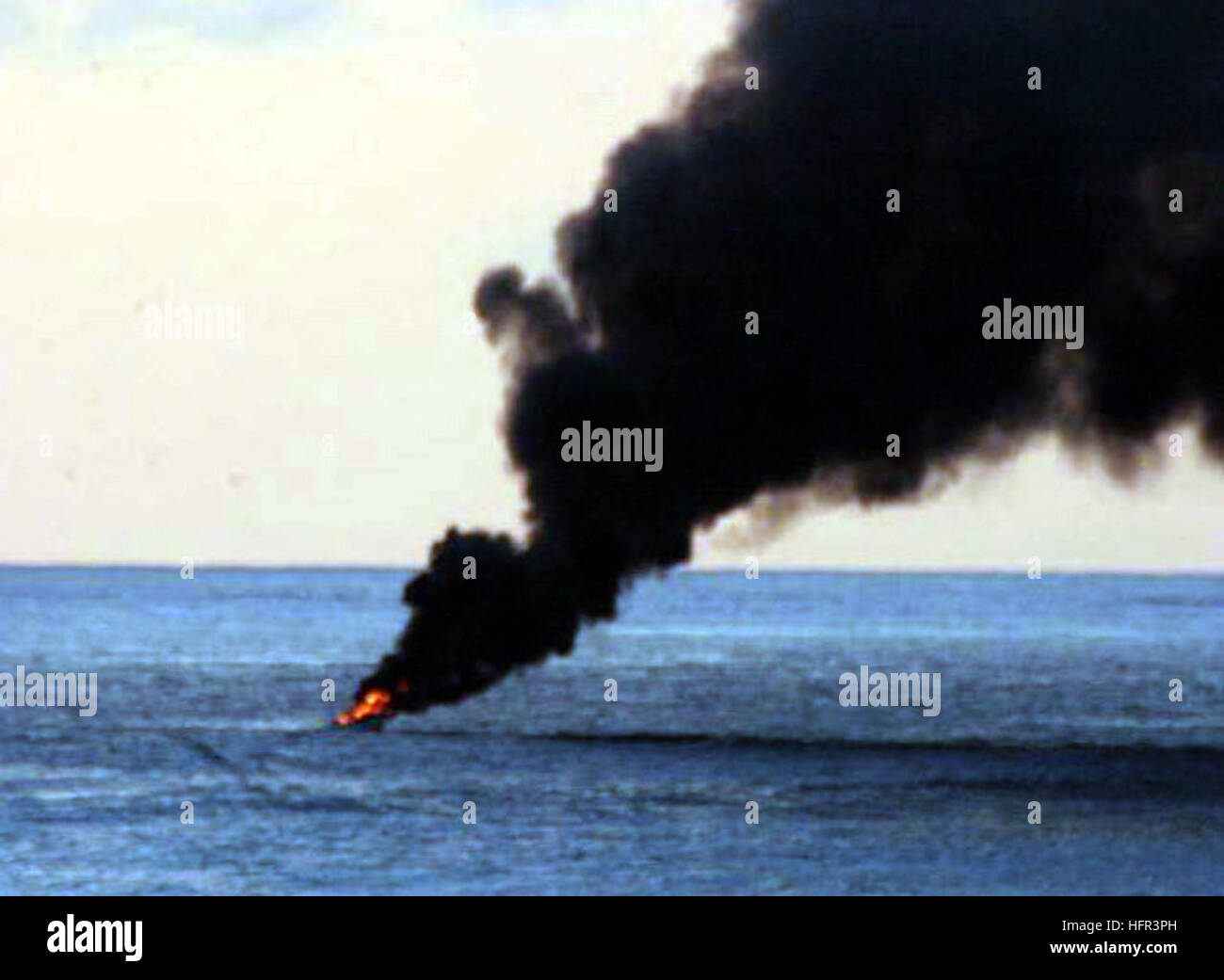 060318-N-8623S-003 Indian Ocean (March 18, 2006) - A suspected pirate vessel ignites in flames before burning to the waterline. USS Gonzalez (DDG 66) and USS Cape St. George (CG 71) were conducting maritime security operations in international waters off the coast of Somalia and attempted to perform a routine boarding of the suspicious vessel towing two skiffs. The suspected pirates opened fire on the U.S. Navy ships and the shipsÕ crew members returned fire.  One suspect was killed and 12 were taken into custody.  Coalition forces conduct maritime security operations to ensure security and sa Stock Photo