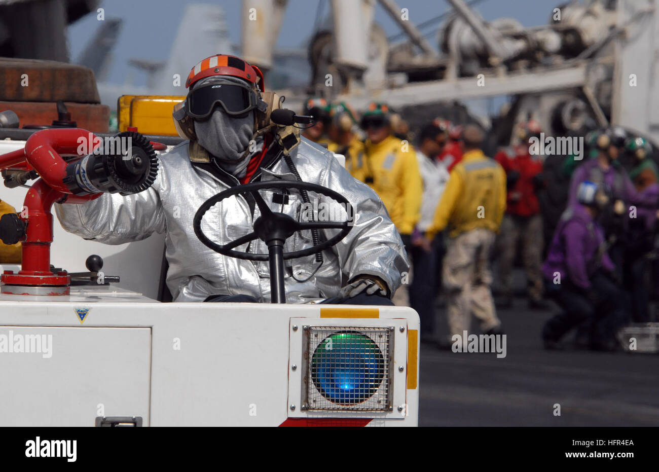 080919-N-4995K-126 GULF OF OMAN (Sept. 19, 2008) A Sailor from the crash and salvage team aboard the Nimitz-class aircraft carrier USS Ronald Reagan (CVN 76) fans the fire hose on the crash cart during flight deck drills. The Crash and salvage team receives specialized training on how to properly handle flight deck and aircraft fires. Ronald Reagan is deployed in the U.S. 5th Fleet area of responsibility. (U.S. Navy photo by Mass Communication Specialist 3rd Class Chelsea Kennedy/Released) US Navy 080919-N-4995K-126 A Sailor from the crash and salvage team aboard the Nimitz-class aircraft carr Stock Photo